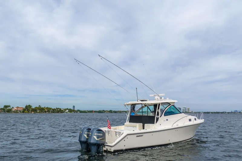  Yacht Photos Pics 2012 Pursuit OS 345 Offshore boat on calm waters.