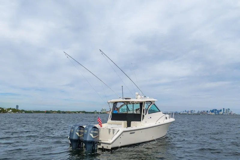  Yacht Photos Pics 2012 Pursuit OS 345 Offshore boat on open water.