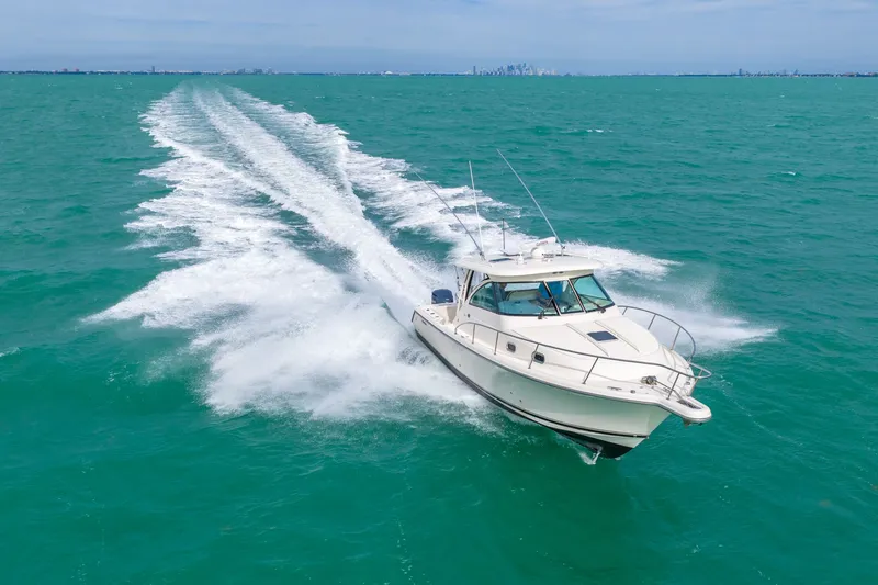  Yacht Photos Pics 2012 Pursuit OS 345 Offshore cruising on open sea.