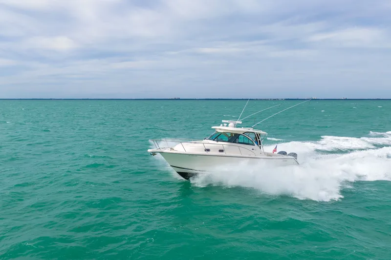  Yacht Photos Pics 2012 Pursuit OS 345 Offshore cruising on open sea.