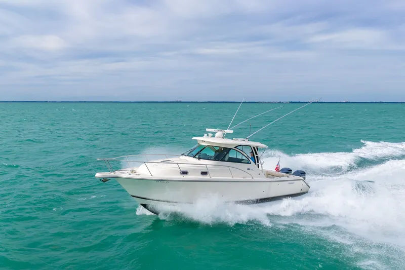  Yacht Photos Pics 2012 Pursuit OS 345 Offshore cruising on open sea.