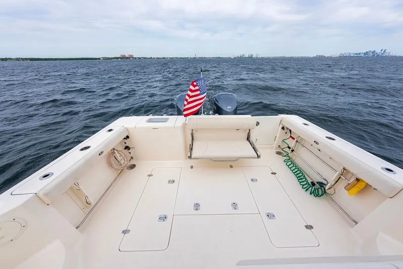  Yacht Photos Pics Aft view of Pursuit OS 345 Offshore yacht on open sea.