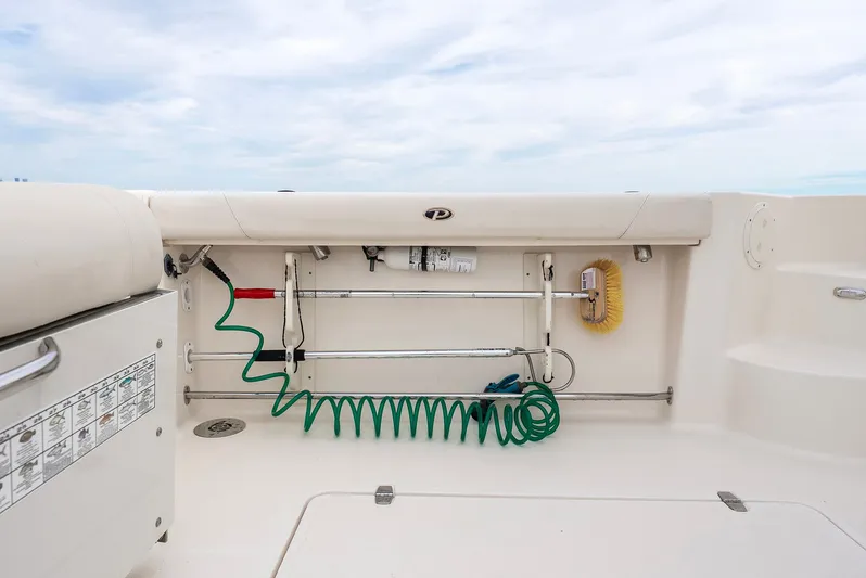  Yacht Photos Pics Pursuit OS 345 Offshore 2012, deck view with cleaning tools.