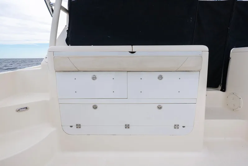  Yacht Photos Pics Pursuit OS 345 Offshore 2012, boat cabin with storage compartments.