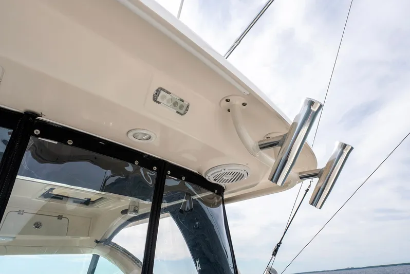  Yacht Photos Pics Pursuit OS 345 Offshore 2012 boat roof with fishing rod holders.