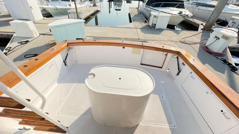 Aqua Ma'am Yacht Photos Pics 1986 Ocean Yachts 38 Super Sport boat deck with wooden trim at marina.