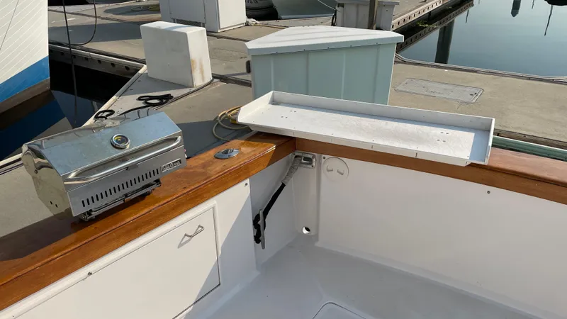 Aqua Ma'am Yacht Photos Pics 1986 Ocean Yachts 38 Super Sport cockpit with grill and storage at marina.