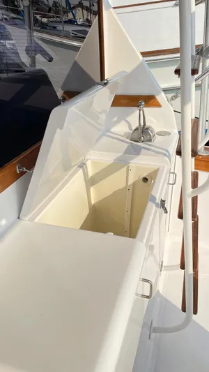 Aqua Ma'am Yacht Photos Pics 1986 Ocean Yachts 38 Super Sport yacht interior with open storage compartment and sink.