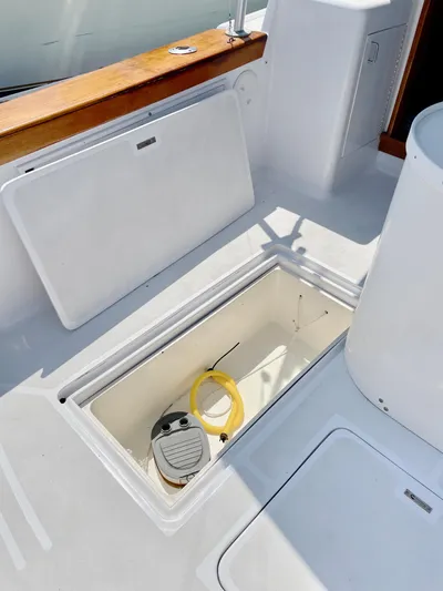 Aqua Ma'am Yacht Photos Pics Open storage compartment on 1986 Ocean Yachts 38 Super Sport boat deck.