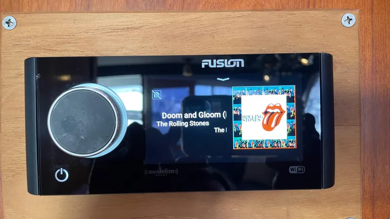 Aqua Ma'am Yacht Photos Pics Fusion stereo system on 1986 Ocean Yachts 38 Super Sport, playing "Doom and Gloom" by The Rolling Stones.