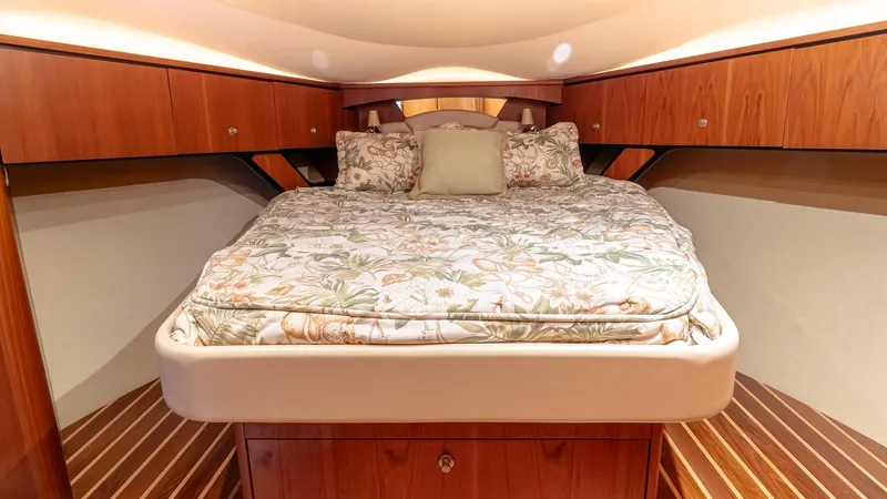  Yacht Photos Pics Luxurious 2007 Tiara Yachts 4300 Sovran cabin with floral bedding and wooden cabinetry.