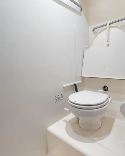  Yacht Photos Pics 2007 Tiara Yachts 4300 Sovran bathroom with white toilet and minimalist design.