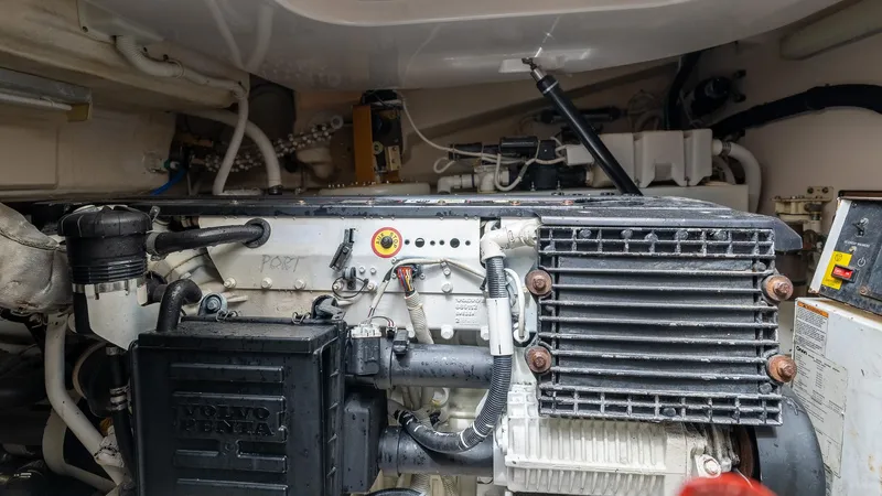  Yacht Photos Pics Engine compartment of a 2007 Tiara Yachts 4300 Sovran, showcasing mechanical components and systems.