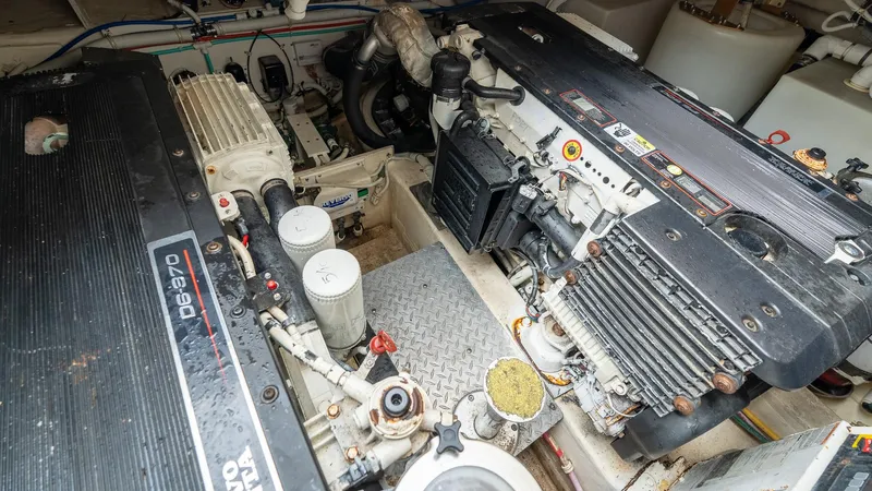  Yacht Photos Pics Engine room of a 2007 Tiara Yachts 4300 Sovran, showcasing dual engines and mechanical components.