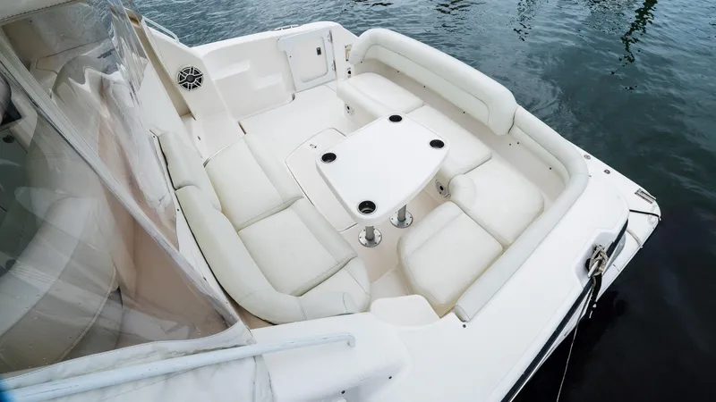  Yacht Photos Pics 2007 Tiara Yachts 4300 Sovran cockpit with white seating and table on water.