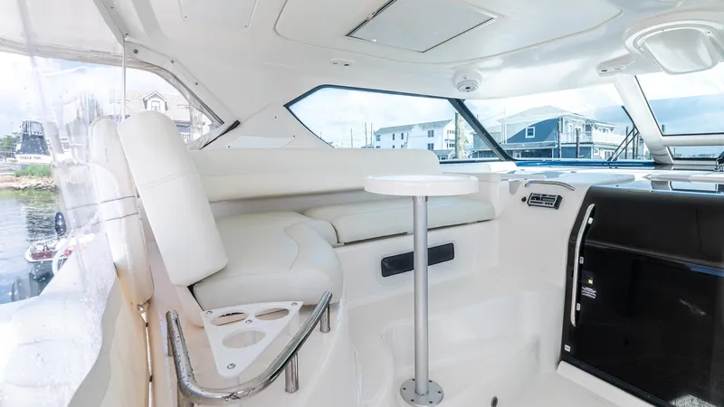  Yacht Photos Pics 2007 Tiara Yachts 4300 Sovran interior with white seating and table.