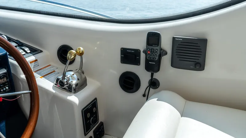  Yacht Photos Pics Control panel of a 2007 Tiara Yachts 4300 Sovran, featuring steering and communication equipment.