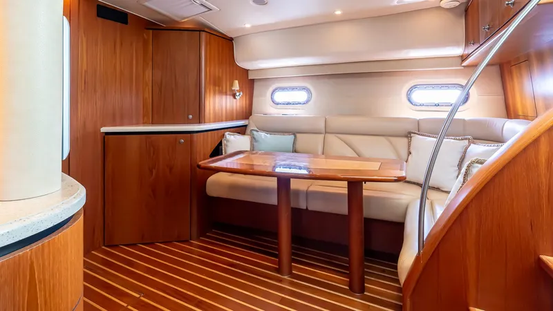  Yacht Photos Pics 2007 Tiara Yachts 4300 Sovran interior with elegant wood finish and cozy seating area.