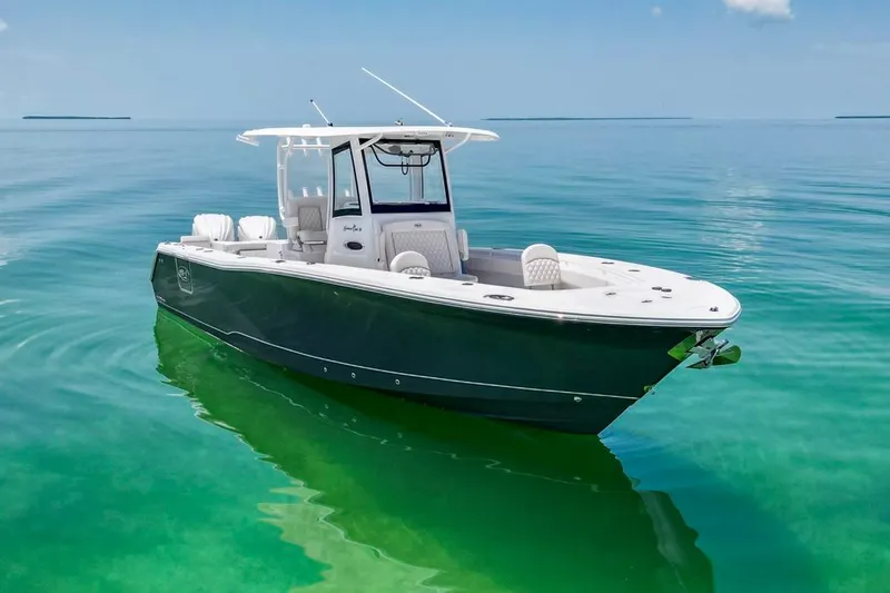  Yacht Photos Pics 2026 Sea Hunt Gamefish 30 Forward Seating boat on clear turquoise water.