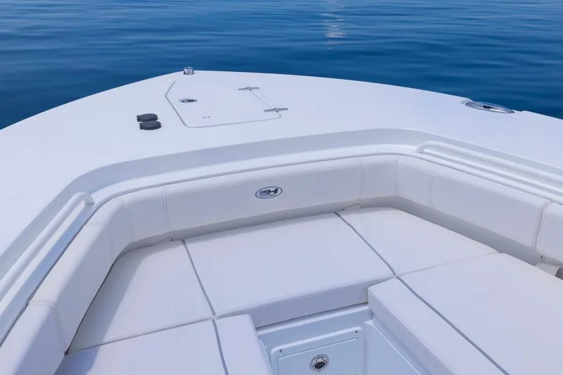  Yacht Photos Pics 2026 Sea Hunt Gamefish 30 Forward Seating, white cushioned deck, calm blue water background.