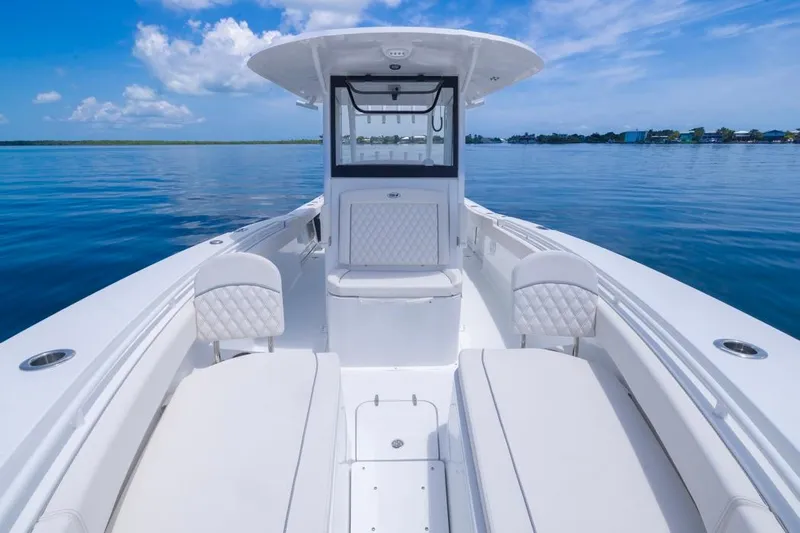  Yacht Photos Pics 2026 Sea Hunt Gamefish 30 Forward Seating boat on calm water, clear sky.