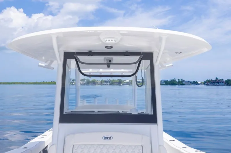  Yacht Photos Pics 2026 Sea Hunt Gamefish 30 boat on calm water, featuring forward seating and sleek design.