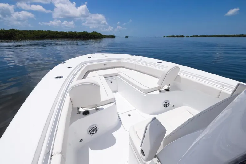  Yacht Photos Pics 2026 Sea Hunt Gamefish 30 Forward Seating boat on calm water under blue sky.