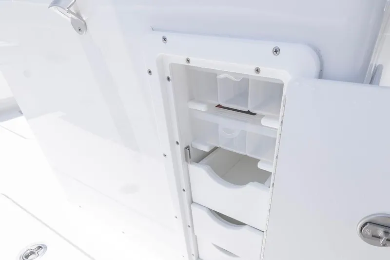  Yacht Photos Pics 2026 Sea Hunt Gamefish 30 storage compartment with organized shelves and drawers.