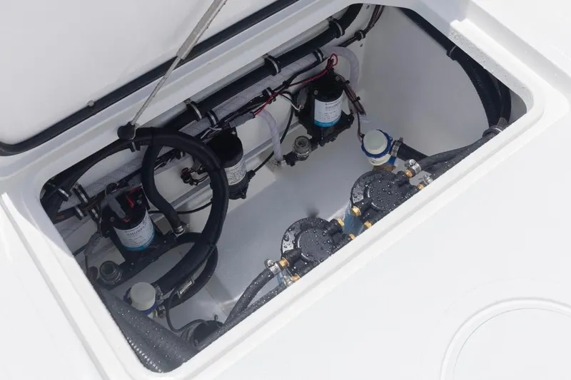  Yacht Photos Pics 2026 Sea Hunt Gamefish 30 Forward Seating boat compartment with pumps and hoses.