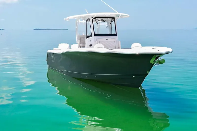  Yacht Photos Pics 2026 Sea Hunt Gamefish 30 Forward Seating boat on calm turquoise water.