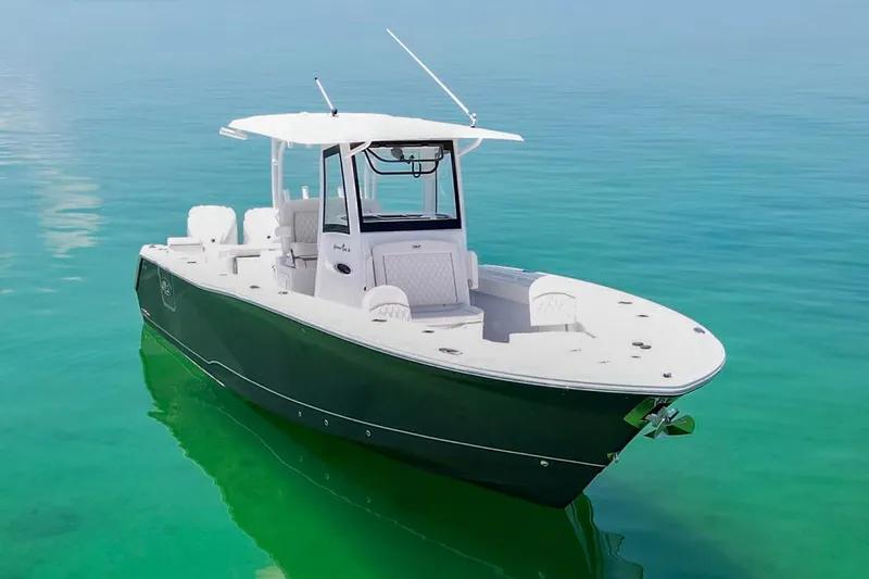  Yacht Photos Pics 2026 Sea Hunt Gamefish 30 Forward Seating boat on clear turquoise water.