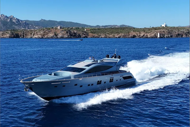 Deea II Yacht Photos Pics Luxurious 2009 Cerri Cantieri Navali 102 yacht cruising on blue ocean waters.