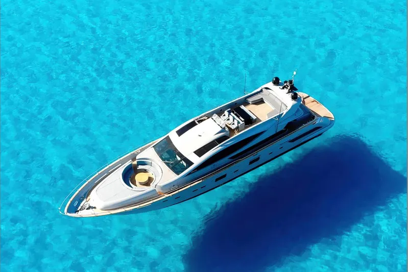 Deea II Yacht Photos Pics Luxurious 2009 Cerri Cantieri Navali 102 yacht on crystal-clear blue water.