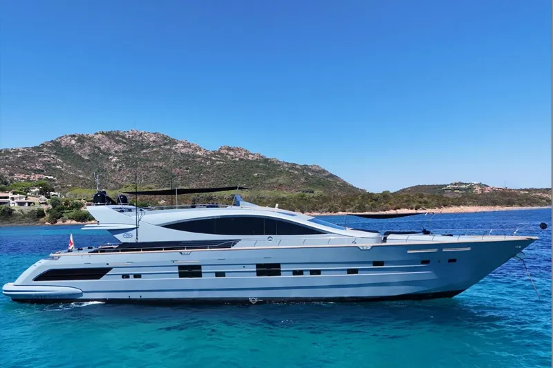 Deea II Yacht Photos Pics Luxurious 2009 Cerri Cantieri Navali 102 yacht cruising in clear blue waters.