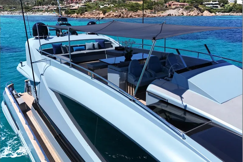 Deea II Yacht Photos Pics Luxurious 2009 Cerri Cantieri Navali 102 yacht on turquoise waters, featuring spacious deck seating.