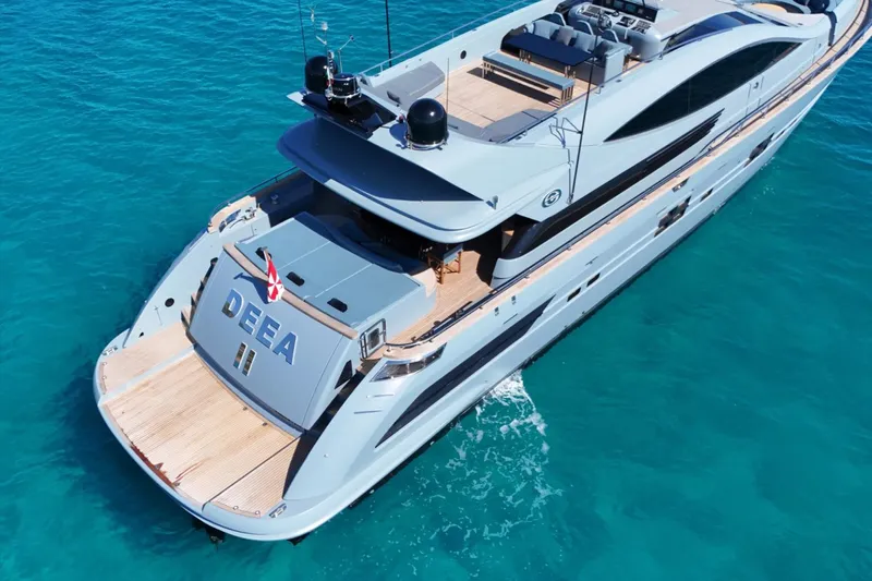 Deea II Yacht Photos Pics Luxurious 2009 Cerri Cantieri Navali 102 yacht cruising in clear blue waters.