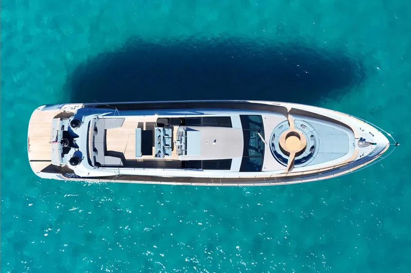 Deea II Yacht Photos Pics Aerial view of 2009 Cerri Cantieri Navali 102 yacht on turquoise water.