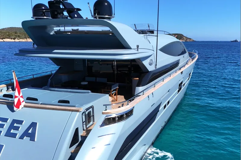 Deea II Yacht Photos Pics Luxury yacht Cerri Cantieri Navali 102, 2009 model, cruising in clear blue waters.