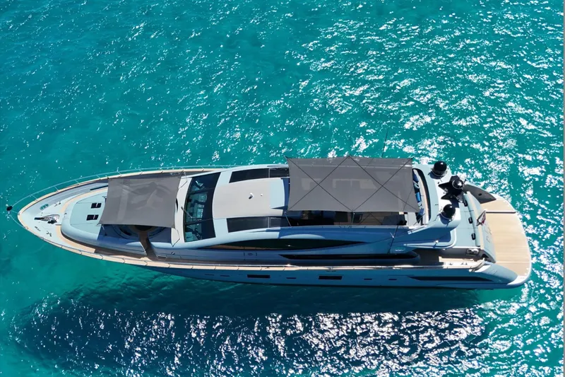 Deea II Yacht Photos Pics Luxurious 2009 Cerri Cantieri Navali 102 yacht on sparkling turquoise water.