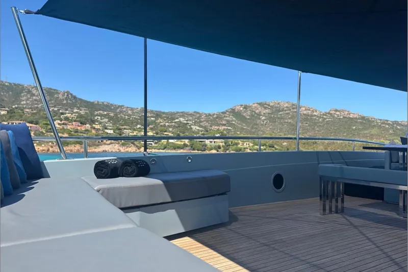 Deea II Yacht Photos Pics Luxurious 2009 Cerri Cantieri Navali 102 yacht deck with scenic mountain view.