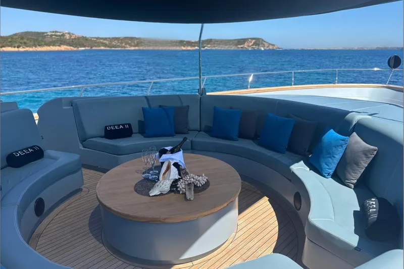 Deea II Yacht Photos Pics Luxurious 2009 Cerri Cantieri Navali 102 yacht deck with elegant seating and ocean view.