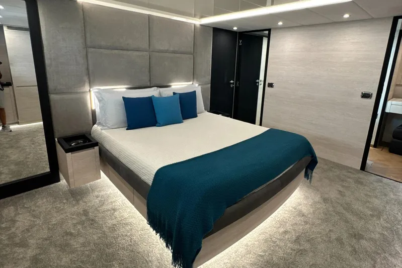 Deea II Yacht Photos Pics Luxurious bedroom interior on 2009 Cerri Cantieri Navali 102 yacht, featuring modern design and elegant decor.