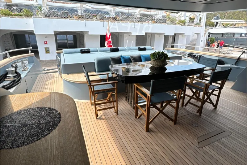 Deea II Yacht Photos Pics Luxurious deck of 2009 Cerri Cantieri Navali 102 yacht with elegant seating and table.