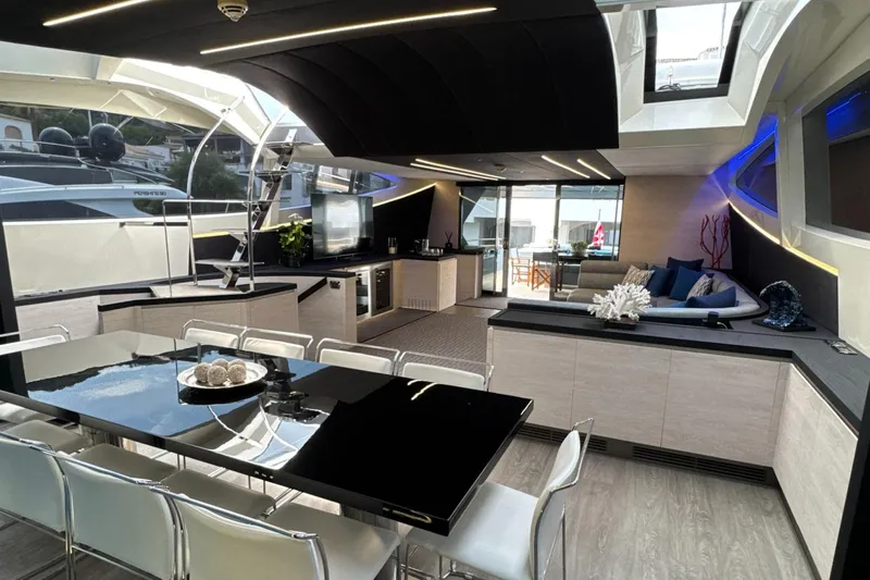 Deea II Yacht Photos Pics Luxurious interior of 2009 Cerri Cantieri Navali 102 yacht with modern dining and lounge area.