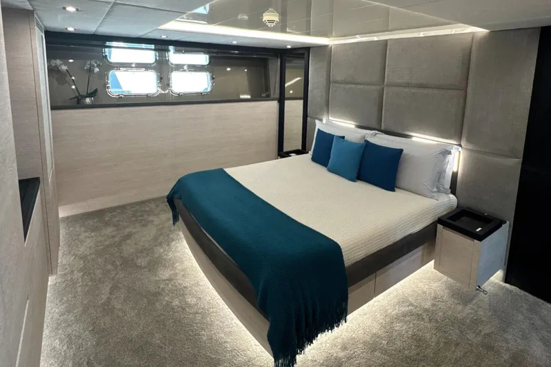 Deea II Yacht Photos Pics Luxurious bedroom interior on 2009 Cerri Cantieri Navali 102 yacht, featuring modern design and elegant decor.