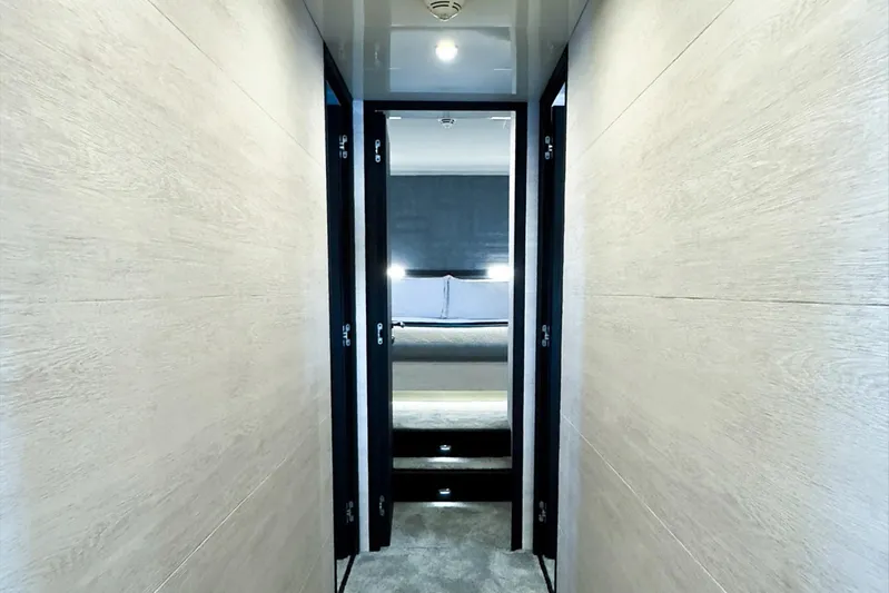 Deea II Yacht Photos Pics Hallway leading to a luxurious bedroom on a 2009 Cerri Cantieri Navali 102 yacht.