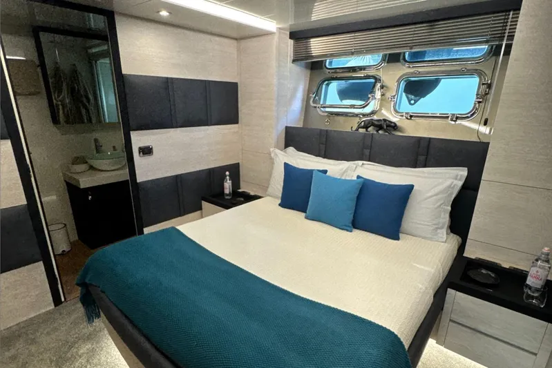 Deea II Yacht Photos Pics Luxurious bedroom interior on 2009 Cerri Cantieri Navali 102 yacht, featuring modern design and ocean view.