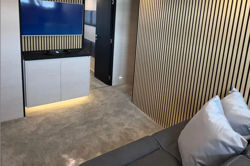 Deea II Yacht Photos Pics Luxurious interior of 2009 Cerri Cantieri Navali 102 yacht with modern decor and TV.