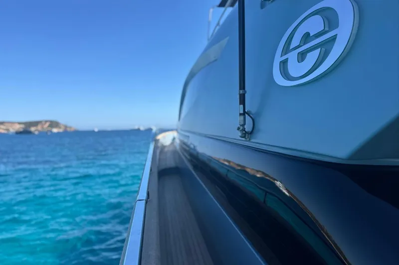 Deea II Yacht Photos Pics Side view of 2009 Cerri Cantieri Navali 102 yacht on clear blue sea.