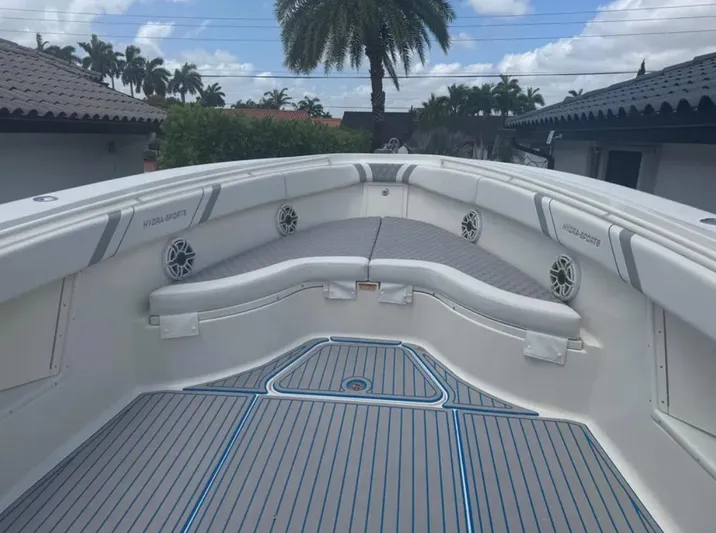  Yacht Photos Pics 2004 Hydra-Sports Vector 33 CC boat interior with cushioned seating and speakers.